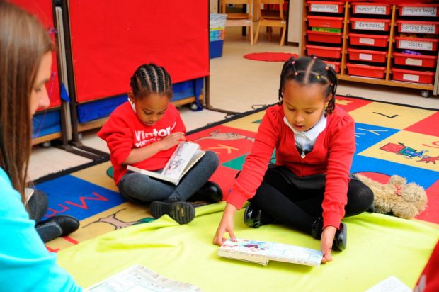 Young pupils reading aloud