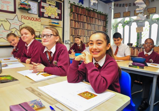 Girls sitting at desks in a classroom