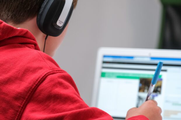 boy working at a laptop