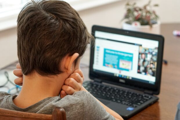 Boy working at a laptop